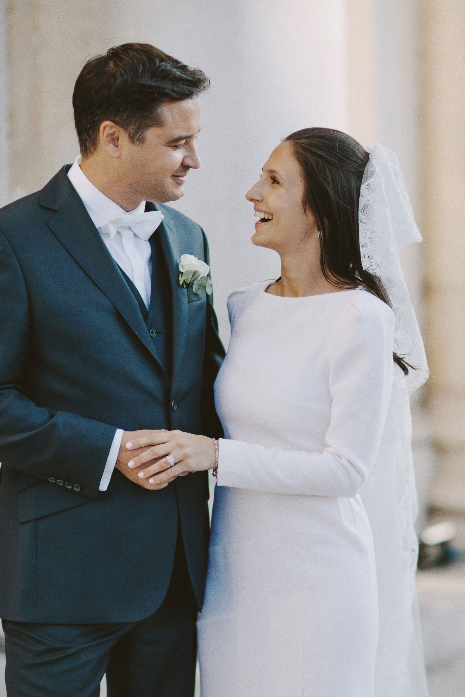 couple portrait with bride and groom smiling at each other